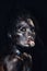 Fashion glamour portrait of a beautiful young caucasian woman. Black messy creative makeup. Dramatic dark image. The