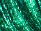 Fashion green sequined sparkling textile close up texture