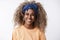 Fashion, happiness and woman wellbeing concept. Attractive african-american joyful hipster girl with blond curly hair