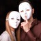 Fashion Happy Couple in Love holding with mask face