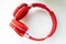 Fashion headphones made of red leather on a white background