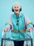 Fashion, headphones and portrait of senior woman with walking frame and vintage 1980s clothes. Retirement, elderly and