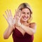 Fashion, laugh and woman with hands on yellow background in trendy, stylish and modern clothes. Laughing, happiness and