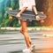 Fashion lifestyle, beautiful young woman with longboard