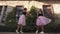 Fashion lifestyle two young women in tulle skirt funnily dancing
