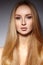 Fashion long hair. Beautiful blond girl. Healthy straight shiny hair style. Beauty woman model. Smooth hairstyle