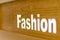 The fashion look word text written on on wooden background, quote, sign, Lettering, concept, blurred background