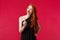 Fashion, luxury and beauty concept. Portrait of bossy good-looking young redhead woman in black dress give warning