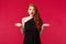 Fashion, luxury and beauty concept. Portrait of shocked and freak-out redhead woman in elegant black dress telling