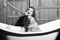 Fashion model. Laughing woman in bath