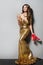 Fashion Model in Long Gold Dress Dancing and Drinking, Happy Elegant Woman, High Heel Shoes