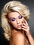 Fashion model with purple manicure and makeup