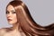 Fashion Model Woman with Beautiful Long Blowing Hair. Glamour Woman with Healthy and Beauty Flying Brown Hair