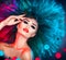 Fashion model woman in colorful bright lights posing. Beautiful girl with trendy makeup