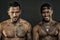 Fashion models smiling African man and tattooed Caucasian guy. Bodybuilders on black background. Sportsmen with sexy