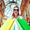 Fashion monger with shopping bags in Galleria Vittorio Emanuele