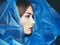 Fashion photo of beautiful women under blue veil