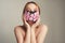 Fashion photo of a girl in a mask of flowers. Spring that we cannot breathe. Virus, pandemic, coronavirus, masked model