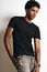 Fashion photo of a handsome man in black t-shirt