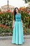 Fashion photo of magnificent woman posing in fine mint dress