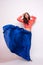 Fashion photo of young magnificent woman in blue dress. Studio photo