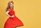 Fashion PinUp Girl in Red Polka Dots Dress.Vintage