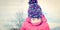 Fashion portait of a little girl in winter clothes having fun in