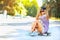 Fashion portrait of attractive girl with a skateboard