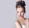 Fashion portrait of a beautiful attractive girl with a gentle elegant evening wedding hairstyles high and bright make-up with flow