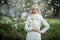 Fashion portrait of beautiful blonde woman in stylish clothes outdoor in spring. Peace in Ukraine