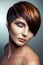 Fashion portrait of a beautiful girl with colored dyed hair, professional short hair coloring.