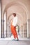 Fashion portrait, cool and black man posing in a city arch building. Stylish lifestyle, retro and handsome creative