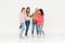 Fashion portrait of four women drinking champagne and having fun