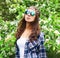 Fashion portrait hippie woman in a flowering garden