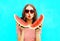 Fashion portrait pretty young woman is holding slice of watermelon and blowing lips