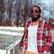 Fashion portrait of stylish young african man listens to music