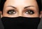 Fashion portrait of woman with hidden face with black polo neck