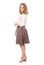 Fashion portrait of a young blonde in a skirt posing in full growth isolated over a white