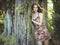 Fashion portrait of young sensual woman in garden