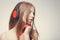 Fashion pretty girl listening music with headphones, wearing red gloves, take pleasure with song. Lifestyle woman concept