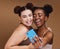 Fashion, selfie and friends with phone smile on brown background for wellness, cosmetics and makeup. Influencer, happy