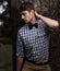 Fashion, serious and hipster with man in nature for retro, trendy and vintage style. Confidence, funky and casual with