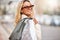 Fashion, shopping bag and portrait of woman in street with sunglasses, retail therapy and financial freedom. Smile