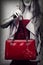 Fashion shot of red patent leather bag