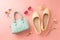 Fashion spring accessories for woman. Mint handbag and yellow ballet flats shoes on pastel pink