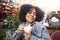 Fashion street style portrait of attractive young natural beauty African American woman with afro hair in tweed jacket