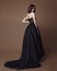 Fashion studio photo of elgant woman in long black dress