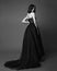 Fashion studio photo of elgant woman in long black dress. Black