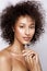 Fashion studio portrait of beautiful african american woman with perfect smooth glowing mulatto skin, make up