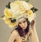 Fashion studio portrait of woman with flowers